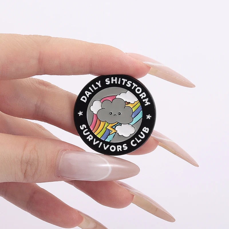 the SHITSTORM SURVIVOR - Daily Shitstorm Survivors Club Enamel Pin, Cartoon Dark Clouds Rainbow Brooch Lapel, Badge Jewelry Gift for Friends