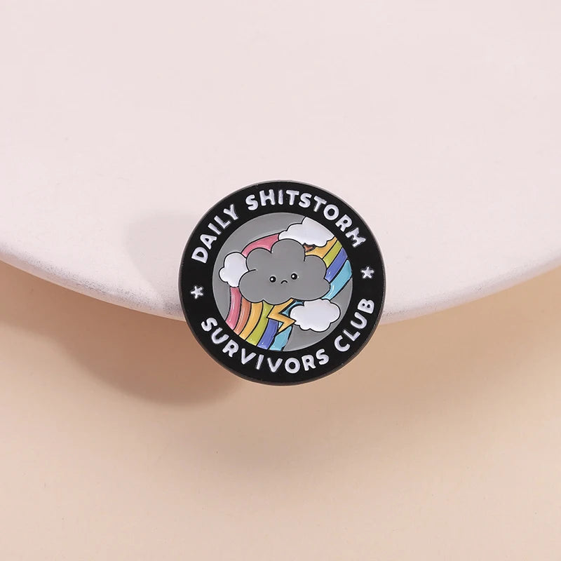the SHITSTORM SURVIVOR - Daily Shitstorm Survivors Club Enamel Pin, Cartoon Dark Clouds Rainbow Brooch Lapel, Badge Jewelry Gift for Friends