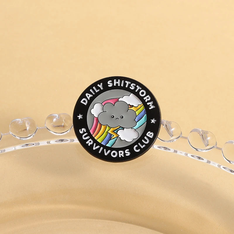 the SHITSTORM SURVIVOR - Daily Shitstorm Survivors Club Enamel Pin, Cartoon Dark Clouds Rainbow Brooch Lapel, Badge Jewelry Gift for Friends